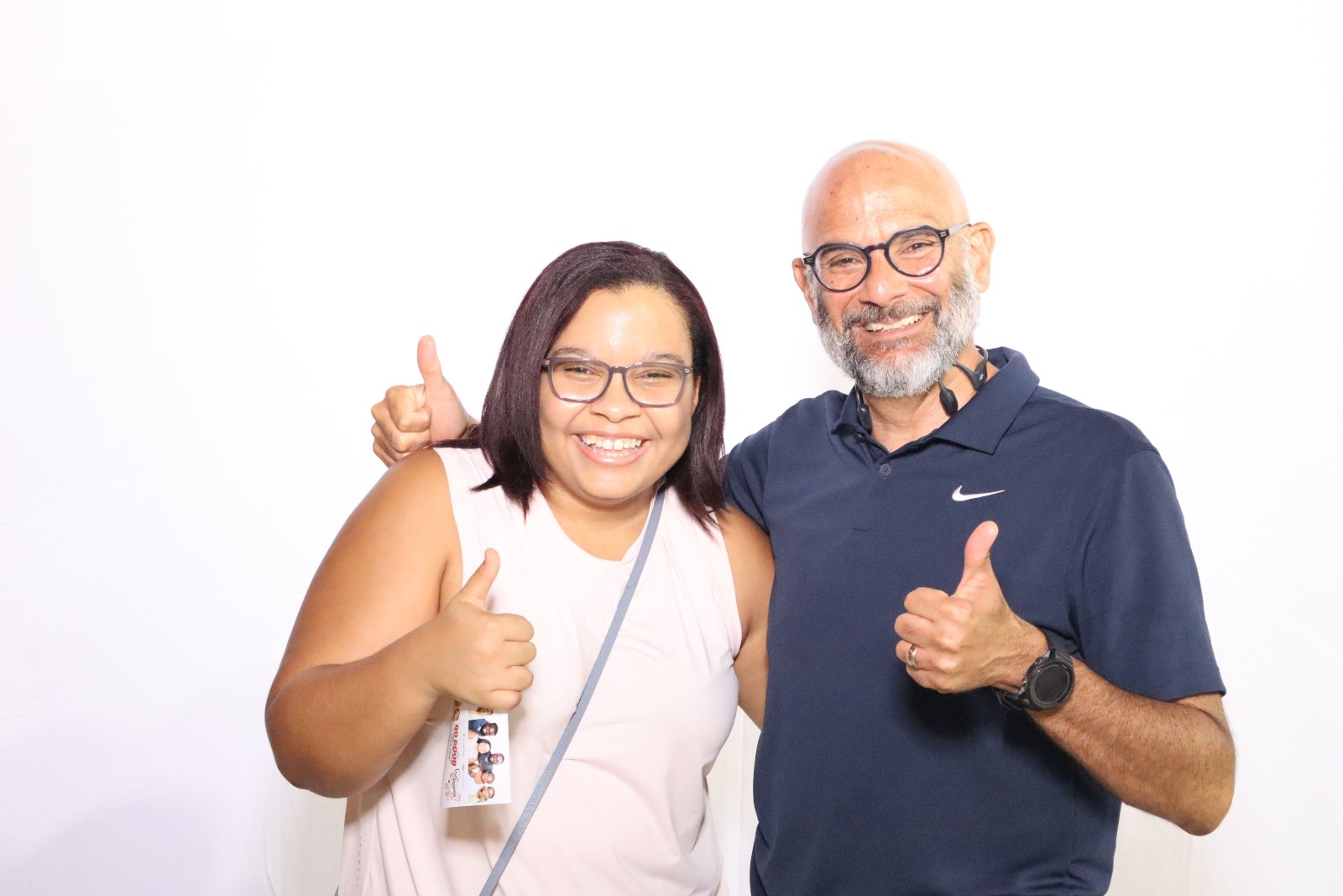 Two guests giving a thumbs up