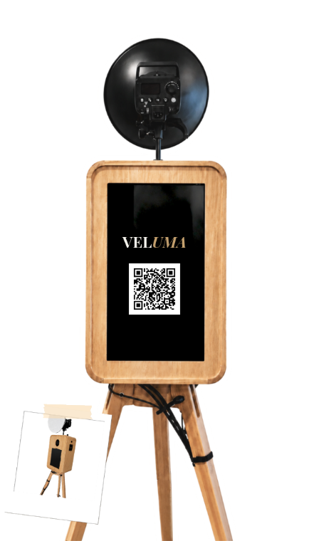 The Luma open-air photobooth in light oak on a wooden tripod