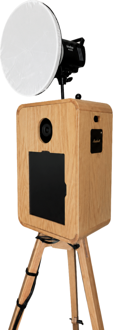 The enclosed Veluma photo booth in light oak