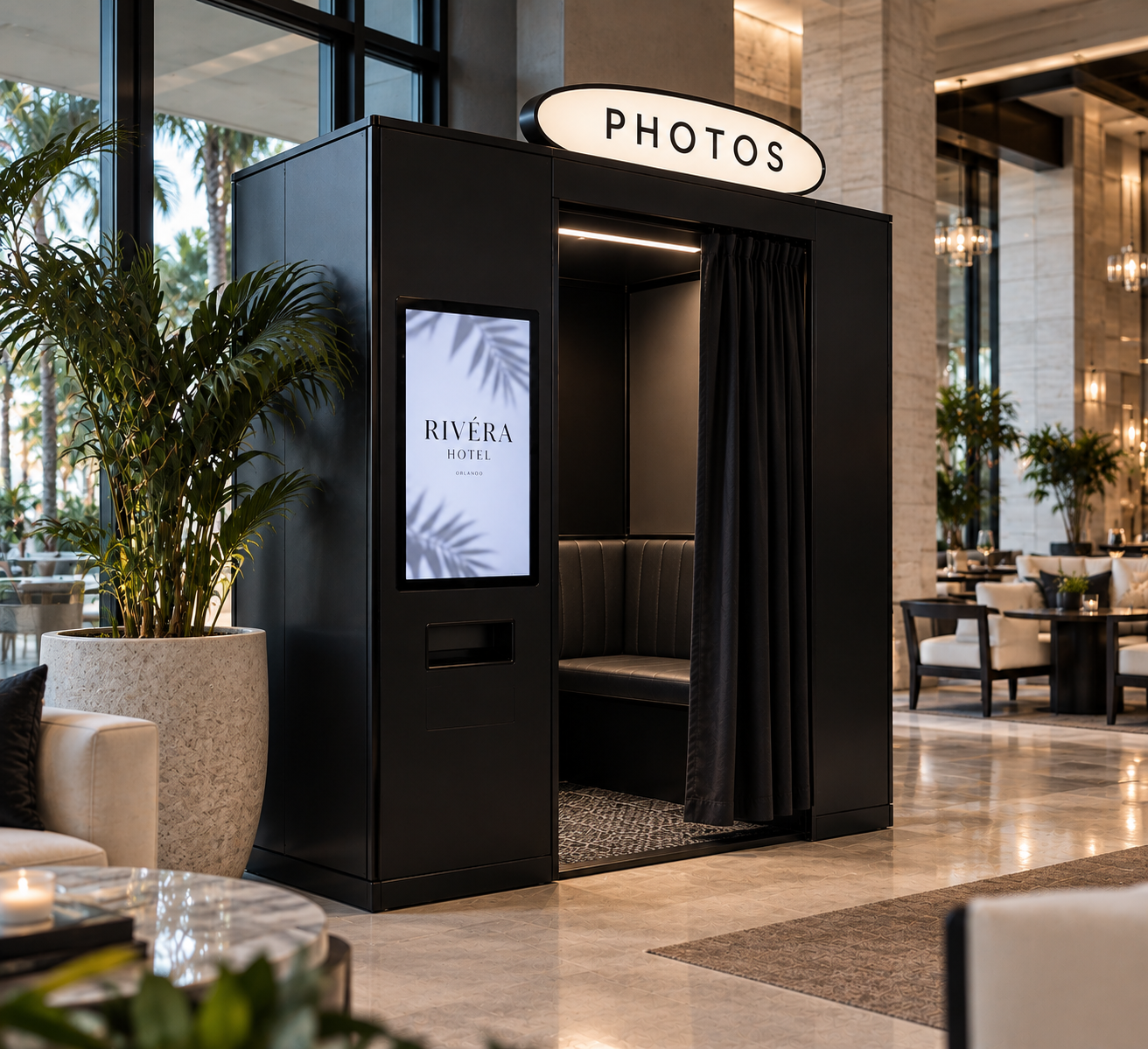 A black Veluma enclosed booth in a hotel lobby
